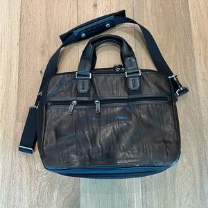 Gently used men’s Tumi leather briefcase with shoulder strap